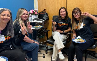 Group of nurses holding peace sign