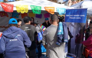 Dia De Los Muertos Crowd at AHS tabling booth.