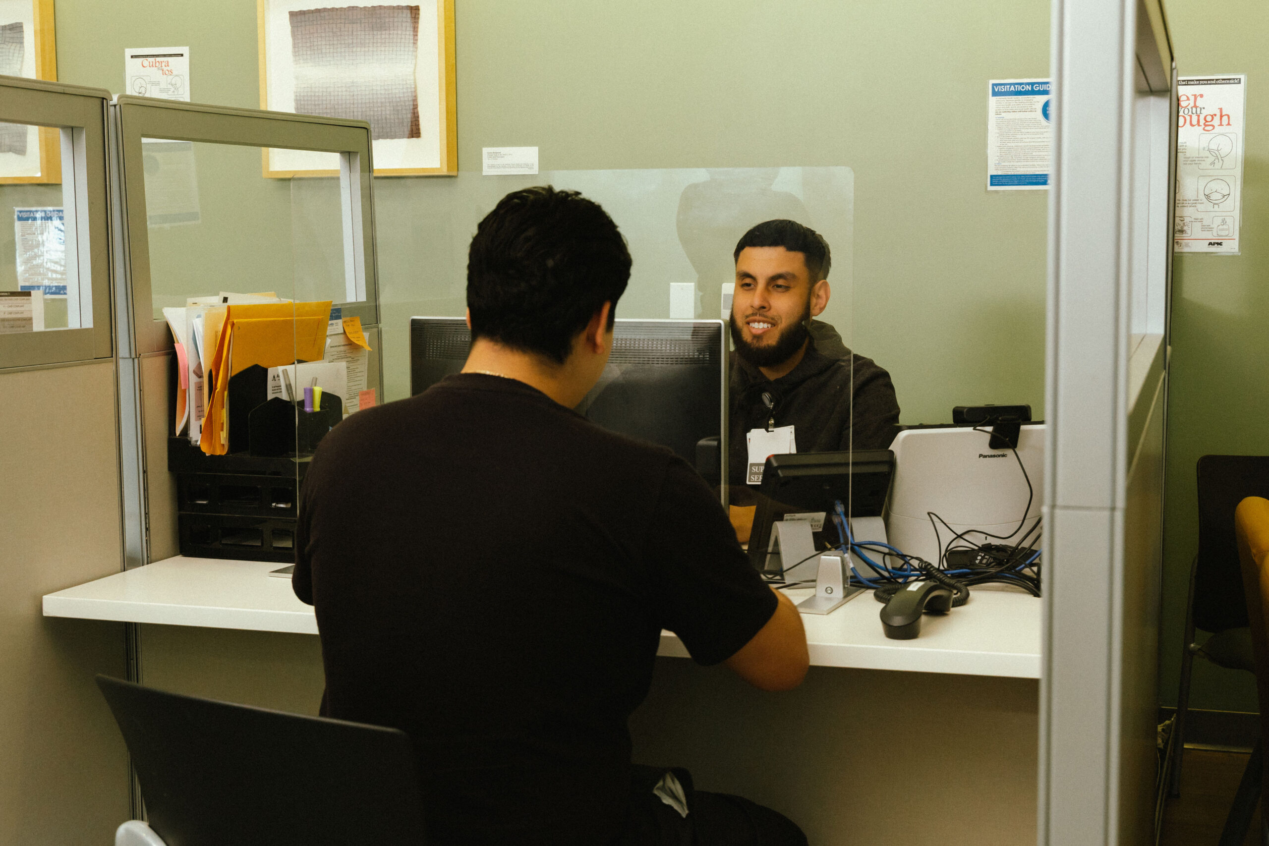 Man registering patient for Ortho appointment.